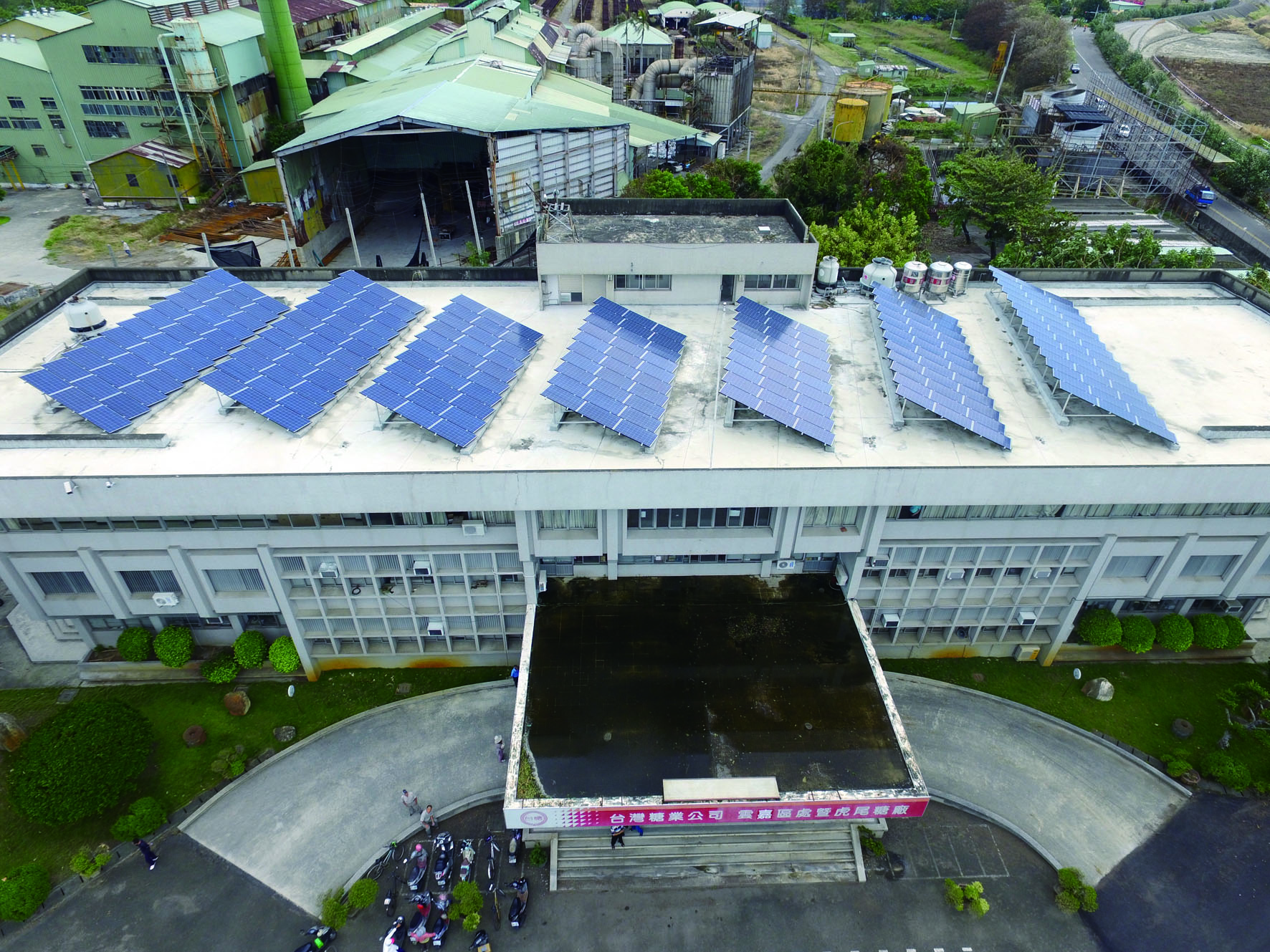 Solar panels on top of the office building in Huwei Sugar Factory.